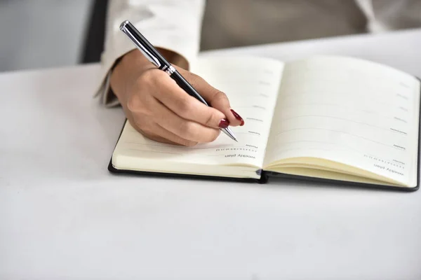 Close Woman Writing Notes Notebook Stock Photo