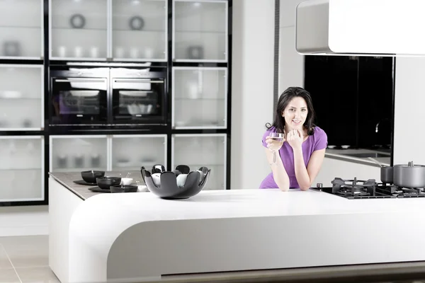 Woman in elegant kitchen — Stok fotoğraf