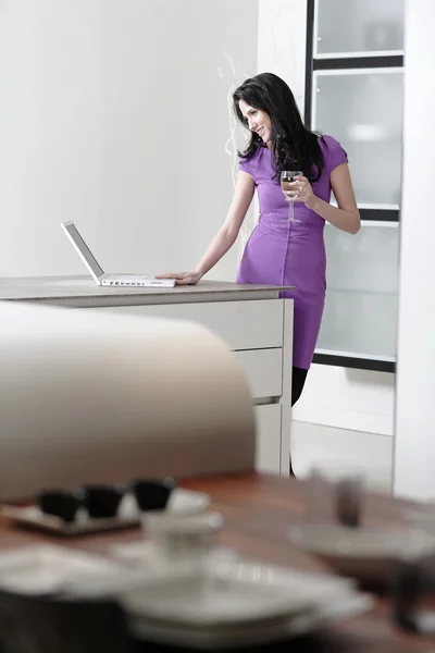 Woman in elegant kitchen — Stok fotoğraf