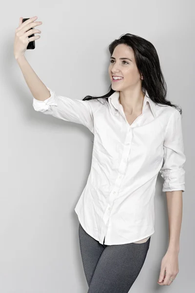 Woman taking a self portrait shot — Stock Photo, Image