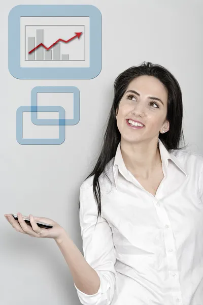 Woman holding out her phone displaying a chart — Stock Photo, Image