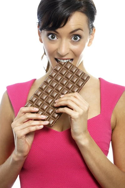 Kvinde spiser chokolade bar - Stock-foto