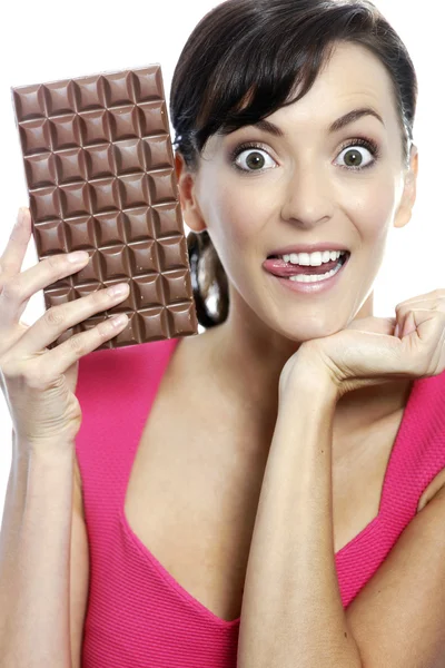 Woman eating chocolate bar — Stock Photo, Image