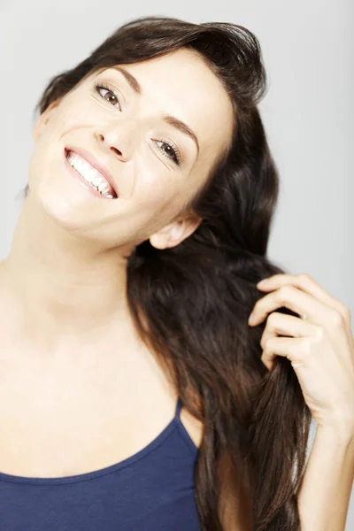 Woman playing with hair — Stock Photo, Image