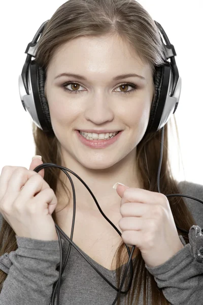 Woman listening to music on headphones Stock Image