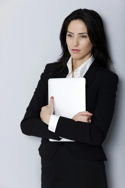 Woman holding her laptop — Stock Photo, Image