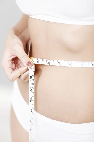 Measuring woman's waist — Stock Photo, Image