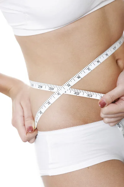 Woman measuring her waist — Stock Photo, Image