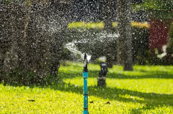 Water splashing from a sprinkler — Stock Photo, Image