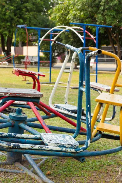 Children carousel and equipment in playground — Stock Photo, Image