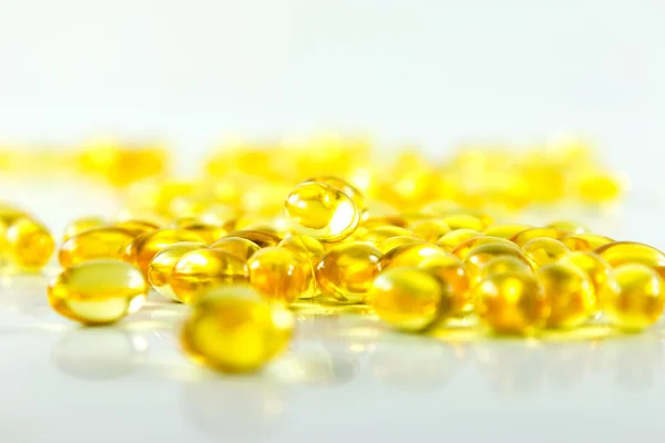 Compose capsules of fish oil white background — Stock Photo, Image