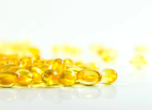 Compose capsules of fish oil white background — Stock Photo, Image