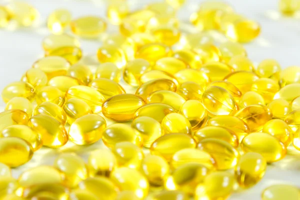 Group capsules of fish oil white background — Stock Photo, Image