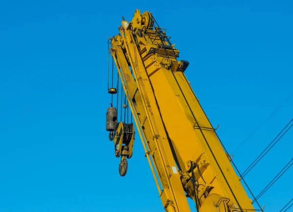 Yellow crane on construction site — Stock Photo, Image