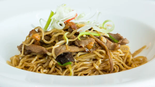 Fried noodle with abalone sauce and BBQ duck — Stock Photo, Image