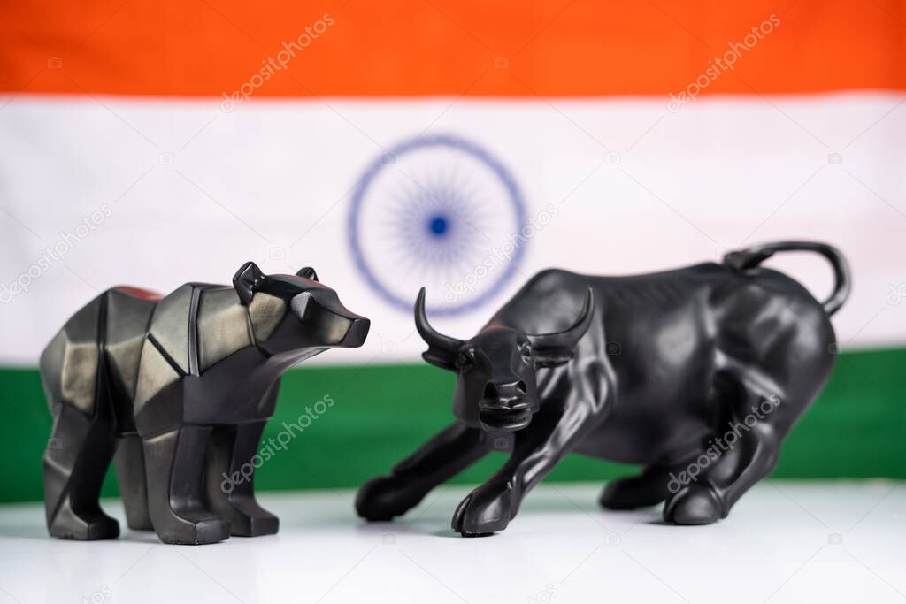 stock market bull and bear with Indian flag as background - Concept of investment in Indian equity sensex share market