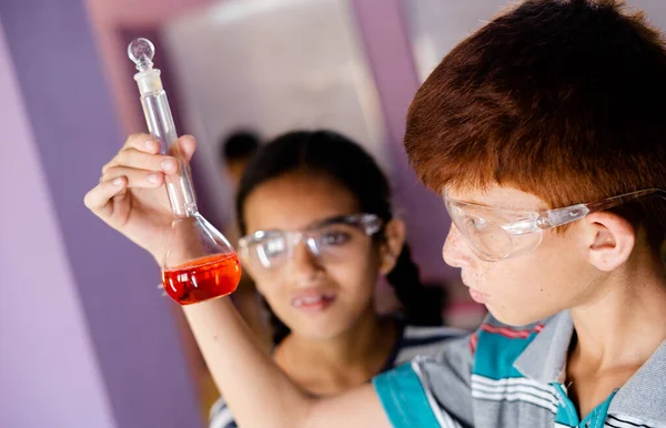 Close Shot Concentrated Kid Mixing Chemicals Florence Flask While Making — Stock Photo, Image