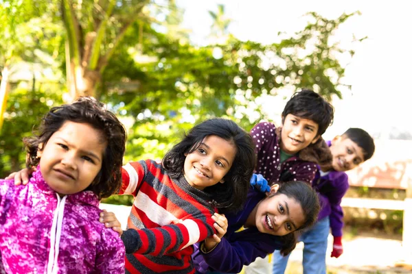 Happy children group playing train game hands on shoulder of friends and around the park - concept of children recreation time, happiness and learning activity. — Stock Photo, Image