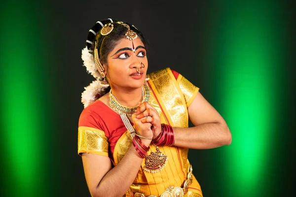 Young bharatnatyam dancer performing fearful or sorrow expression or emotion on stage - concept of indian culture, traditional and classical dance — Stock Photo, Image