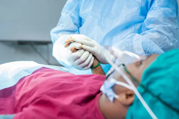 Close up shot doctor at operation theatre consoling patient before operation - concept of trust, empathy and healthcare treatment — 스톡 사진