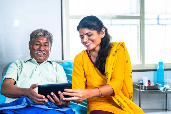 Happy Smiling Sick Father Daughter Watching Digital Tablet While Sitting — Stockfoto