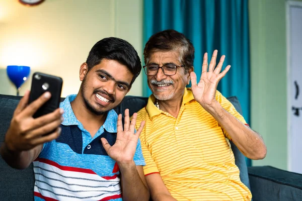 Happy Smiling Grandfather Grandson Making Video Call Mobile Phone Home — 스톡 사진