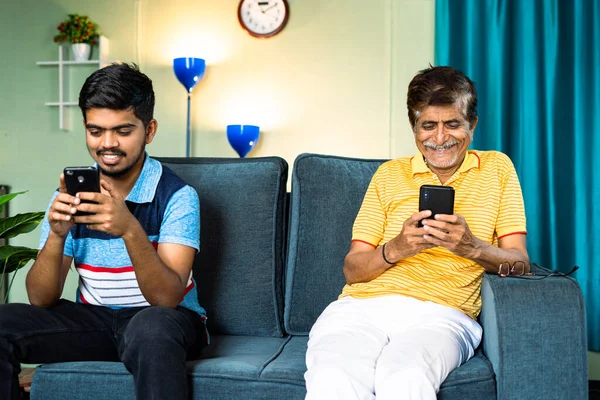 Focus Father Father Son Busy Using Smartphone While Sitting Sofa — Photo
