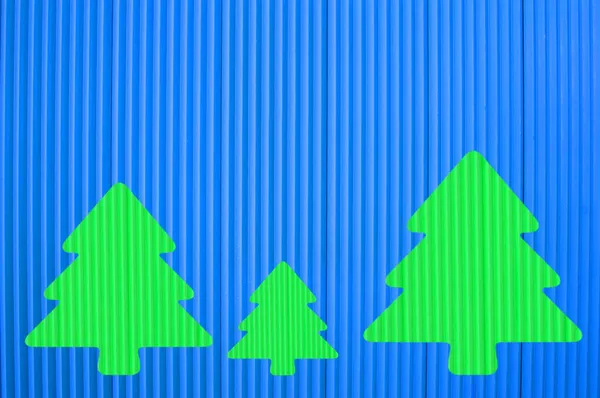 Tři Zelené Vánoční Jedle Modrém Pozadí Vytvořené Počítači Photoshop Fotografií — Stock fotografie