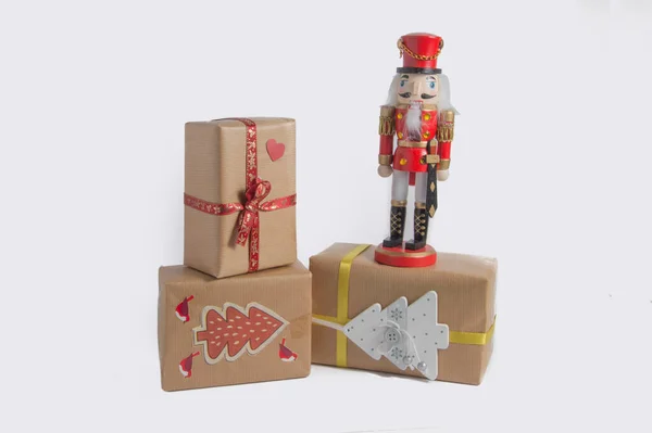 Red Wooden Nutcracker Soldier Christmas Presents Isolated White Background — Stock Photo, Image