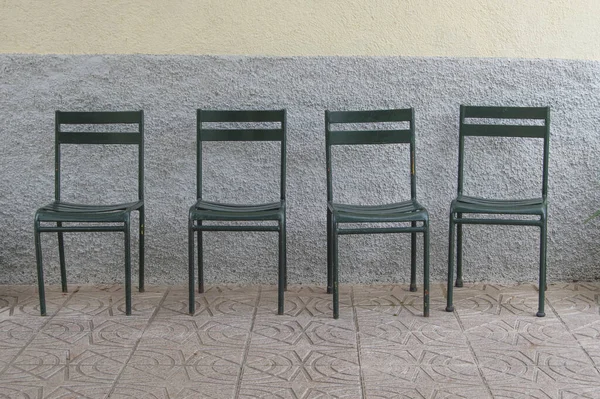 Set Four Metal Chairs Next Wall — Zdjęcie stockowe