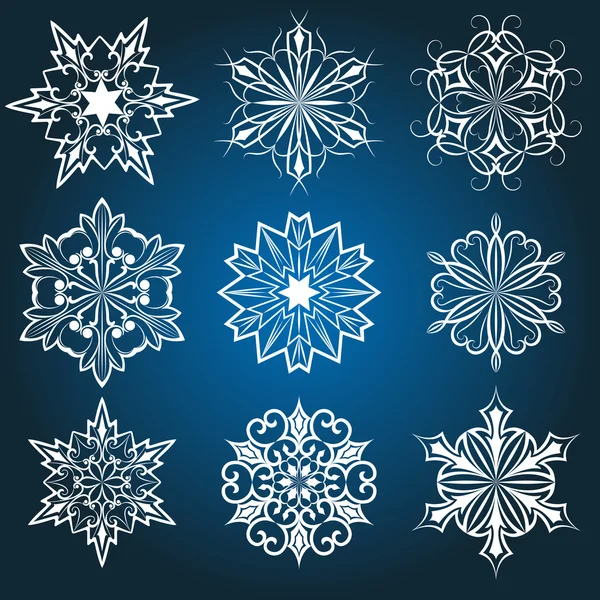 Conjunto de copos de nieve vectoriales aislados sobre fondo azul . — Vector de stock