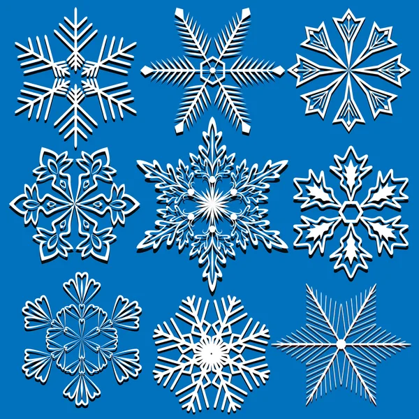 Set of vector snowflakes isolated on blue background. — Stock Vector