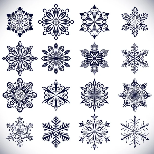 Formas ornamentadas de flocos de neve isolados sobre fundo branco . — Vetor de Stock