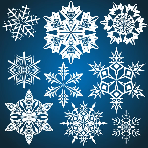 Conjunto de copos de nieve vectoriales aislados sobre fondo azul . — Vector de stock