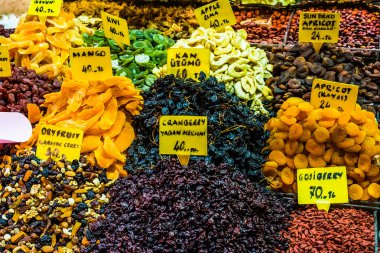 Dry fruits displayed for sale in a bazaar clipart