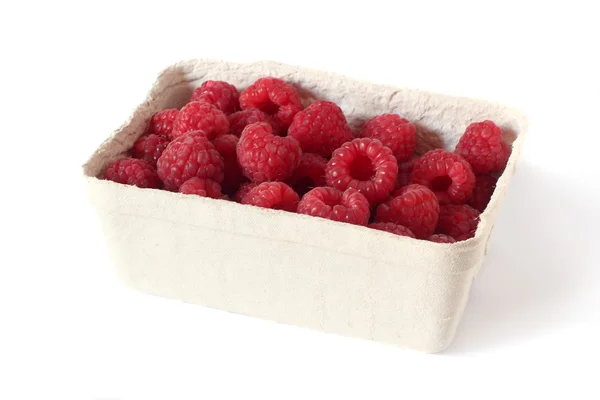 Fresh, sweet raspberries in paper box isolated on white — Stock Photo, Image