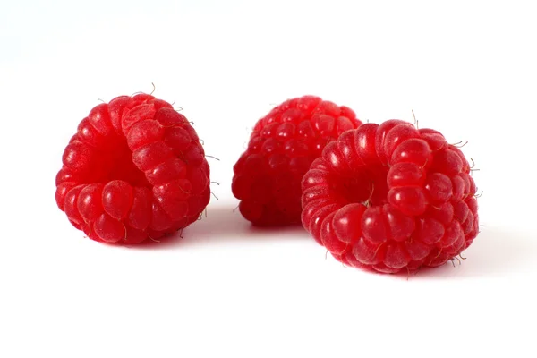 Three ripe, sweet raspberries isolated on white — Stock Photo, Image