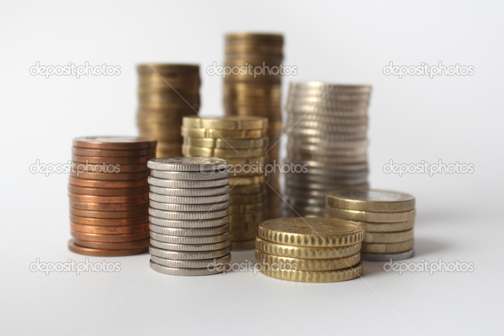 Piles of coins isolated on white background