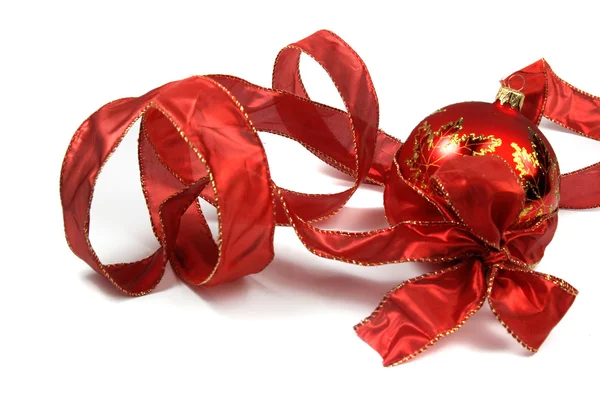 Red christmas ribbon and bauble isolated on white — Stock Photo, Image