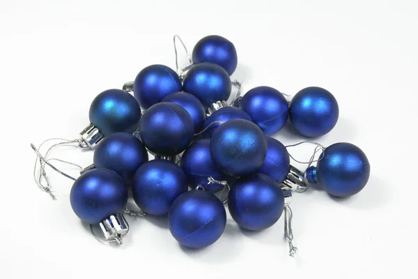 Pile of blue christmas baubles isolated on white background — Stock Photo, Image