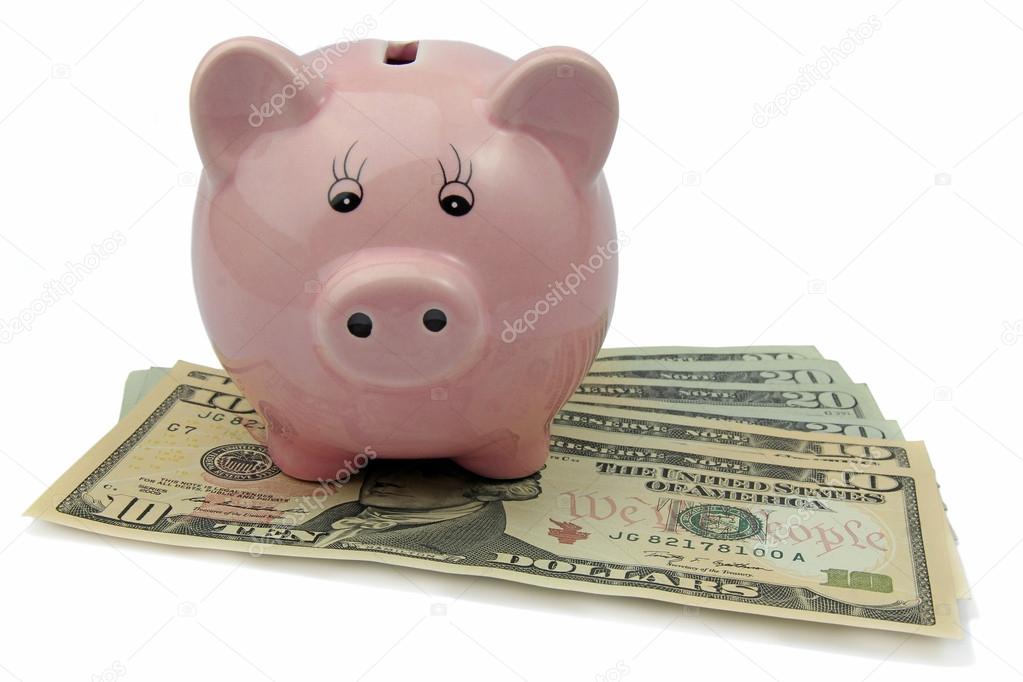 pig bank on dollars isolated on white background