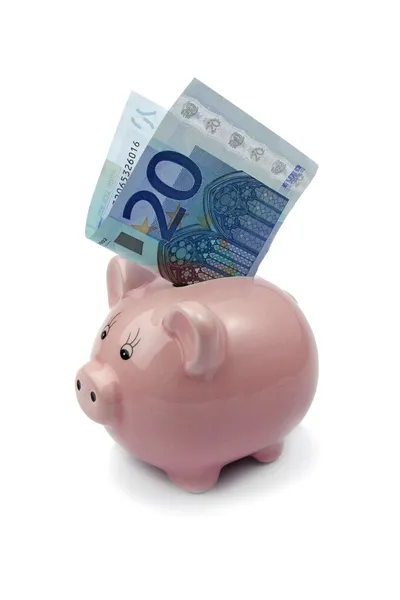 Sparschwein mit zwanzig Euro auf weißem Hintergrund Stockfoto