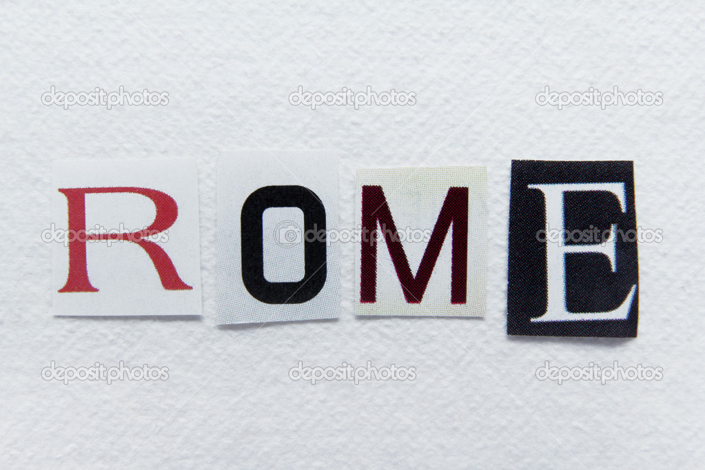 word rome cut from newspaper on handmade paper