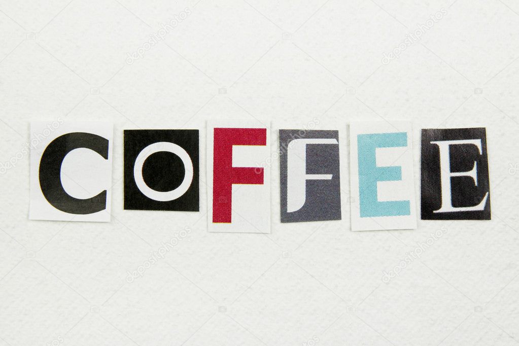 coffee word cut from newspaper on white handmade paper
