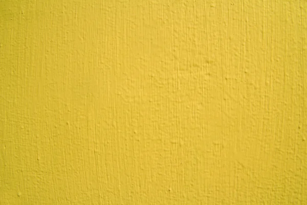 Gele muur textuur of achtergrond — Stockfoto
