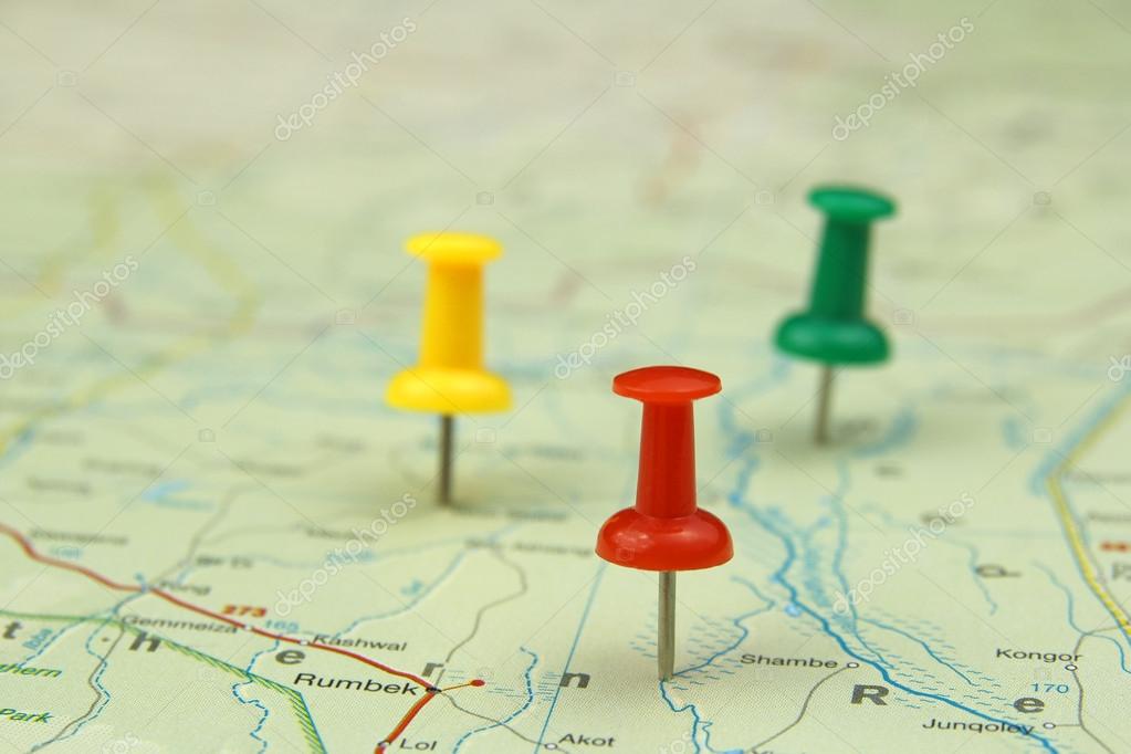 Colorful push pins on a road map Stock Photo by ©chrupka 25357797
