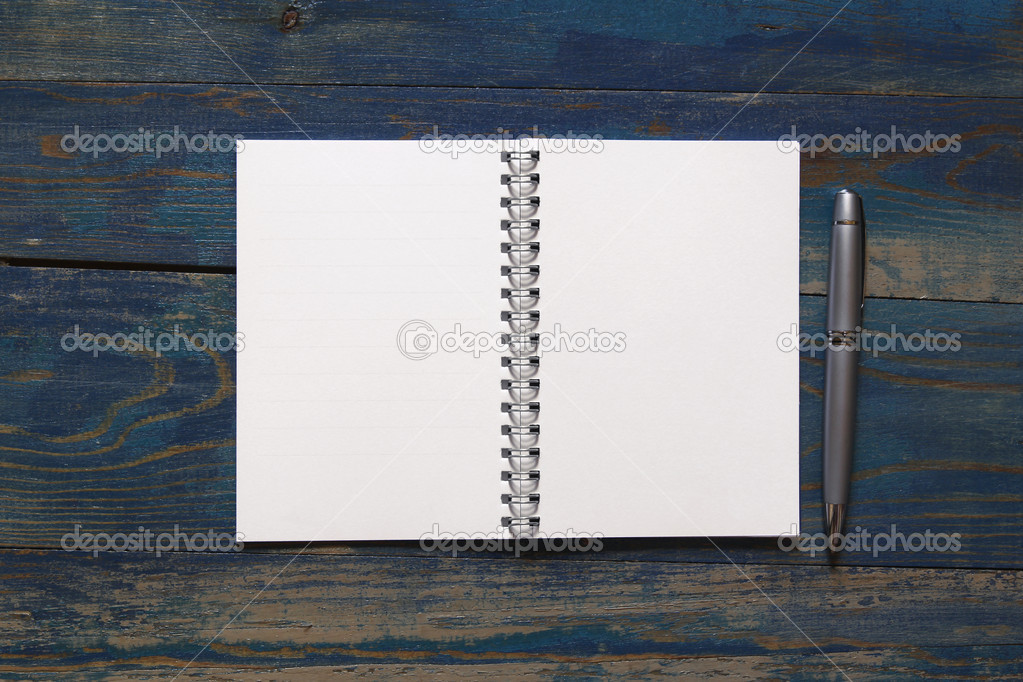 Blank notebook on wooden desk