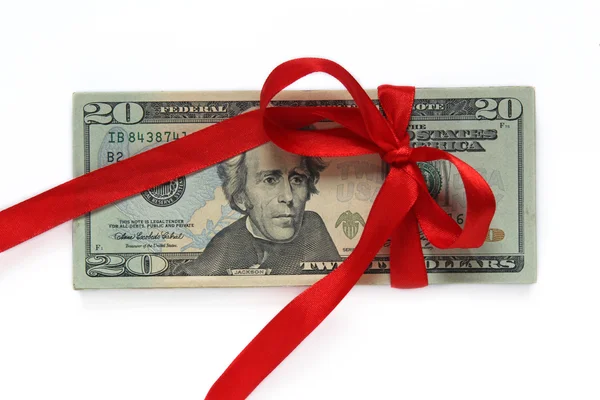 Dollars tied with red ribbon isolated on white — Stock Photo, Image