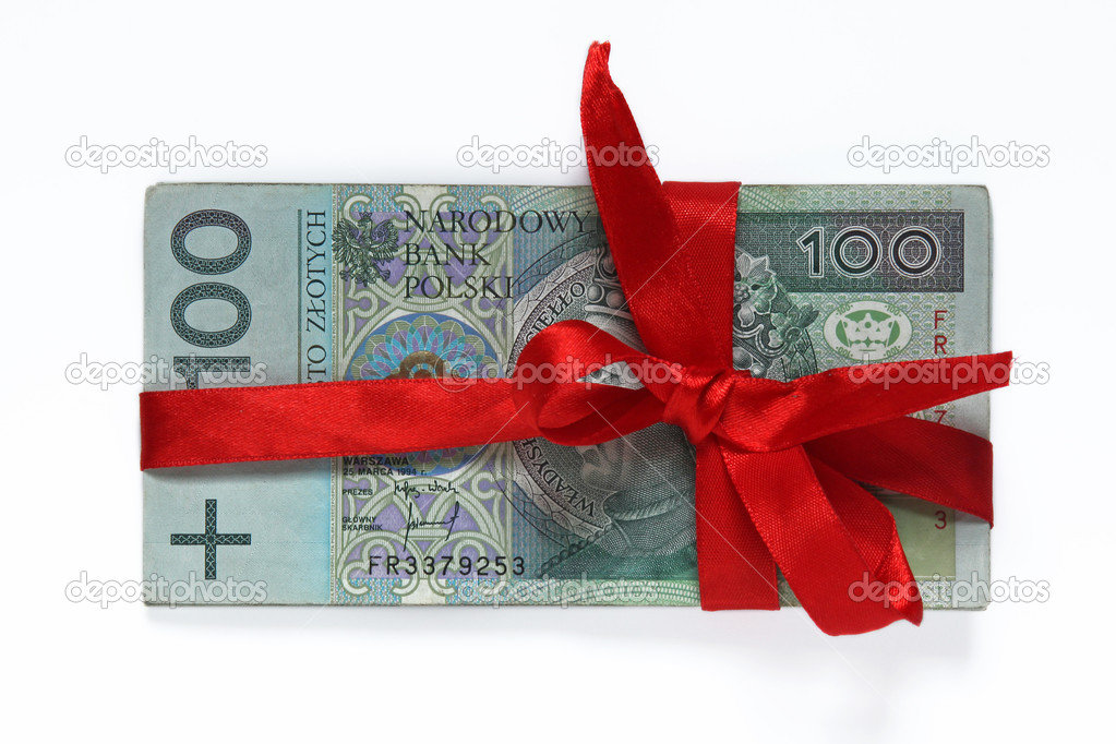 Hundred polish money tied with red ribbon isolated on white