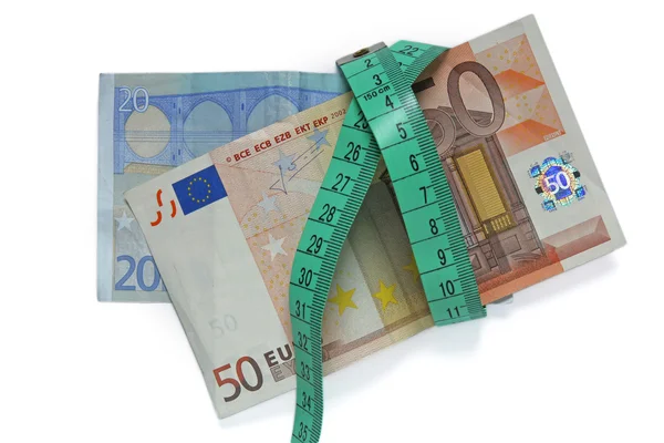 Euro bankovky a měr páska — Stock fotografie